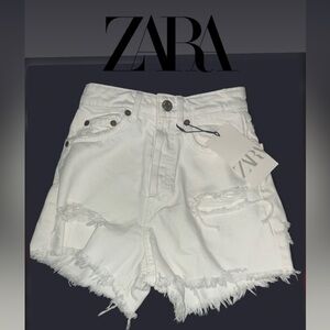 Women’s- Zara Ripped Denim Shorts in white, featuring a high-rise fit. Size 0